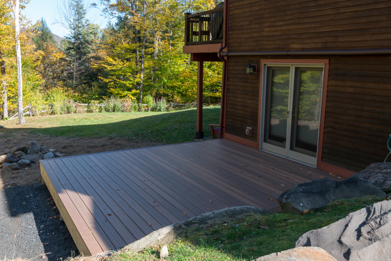 wooden deck with glass sliding doors