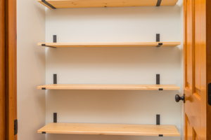 wooden shelves in closet remodel