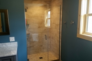 new bathroom interior with glass shower door