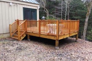 wooden deck with wood railing