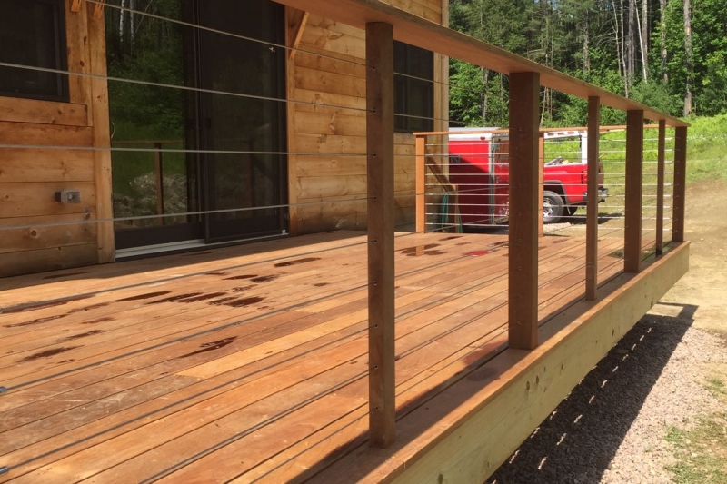 wooden deck with wire railing